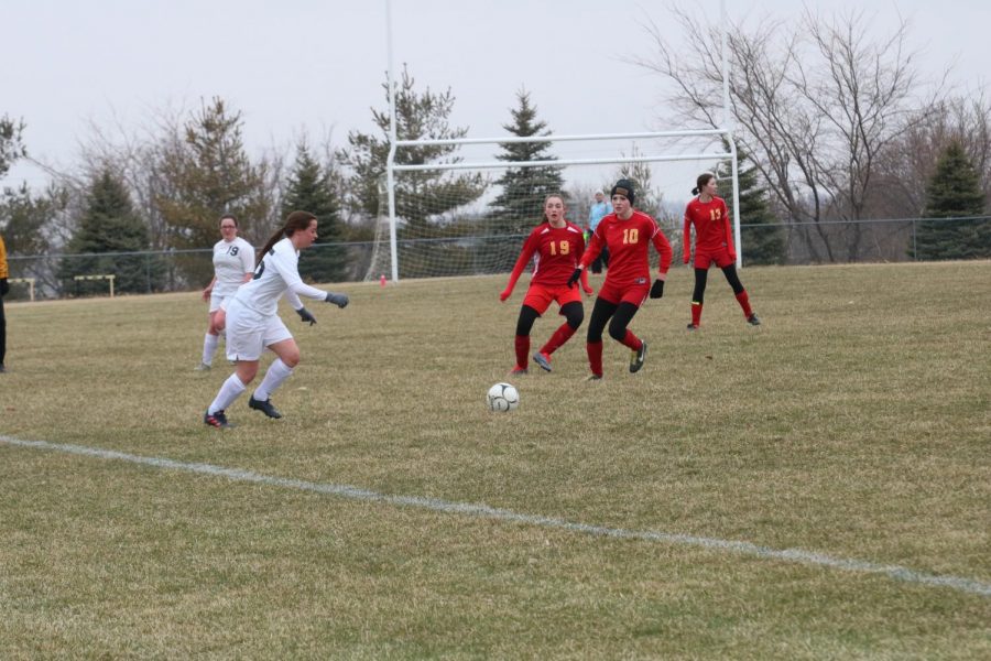 MINE MINE MINE - Junior Erin Barrick is preparing to take what's hers and pass it to junior Ana Muell last year. Barrick played defensive mid and Muell played forward. 