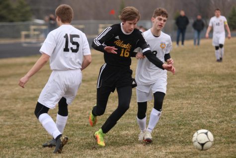 TAKING CHARGE - Senior Nathan Brockman sprints for the ball during the matchup against the Tri-Center Trojans. Brockman is a captain for the team this year. 