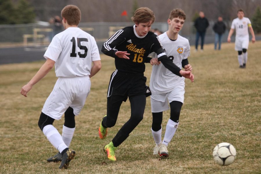 TAKING CHARGE - Senior Nathan Brockman sprints for the ball during the matchup against the Tri-Center Trojans. Brockman is a captain for the team this year. 