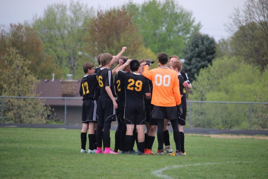 TROJANS ON THREE - Members of the varsity soccer team come together before the start of the home game against the Harlan Cyclones. The Trojans fell to the Cyclones 4-0. 