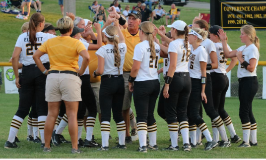 The Trojan softball team breaks down before a game last season. In 2018, their record was 30-7, which included a state berth.