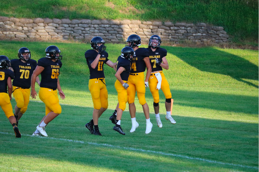 The Trojans celebrate after a big play in the scrimmage against AHSTW.