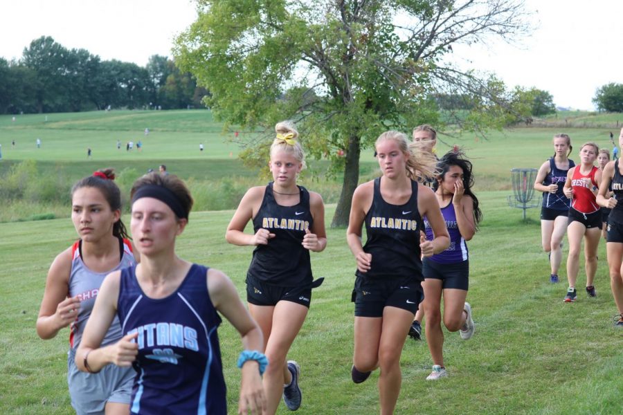 Freshmen Dana Dreager and Edria Brummer focus on finishing. Both runners tear up the JV circuit. 