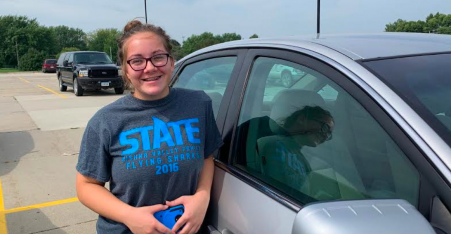 Junior+Dazia+Sorensen+stands+by+car+in+the+high+school+parking+lot.+She+bought+her+car+by+herself+when+she+first+turned+16.+Sorensen+makes+all+the+payments+on+her+car%2C+with+the+occasional+help+from+her+parents.+