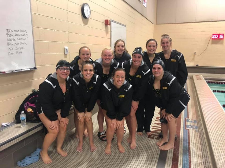 The 2019 girls swim team poses for a picture on Saturday. The girls swim season goes until the beginning of November.