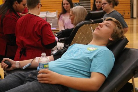 Senior Joel Behrens gives blood at the last blood drive. Behrens plans to donate at this drive as well.