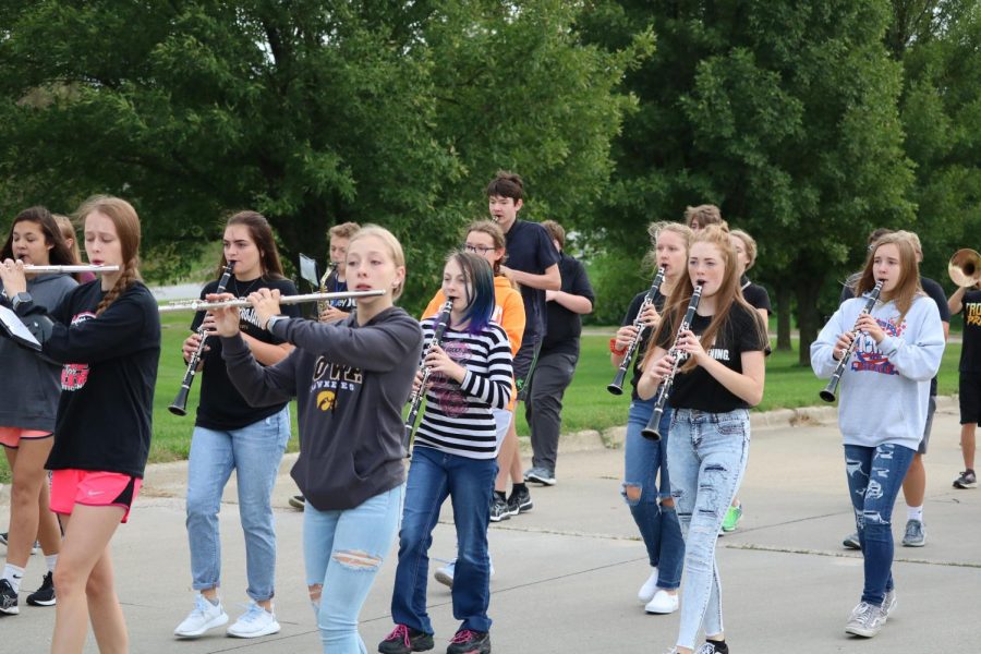 The Trojan Guard practices parade marching outside. They will preform in multiple parades this fall.