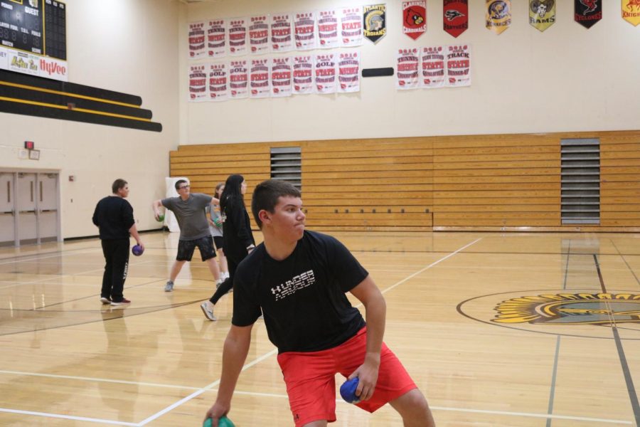 Freshman Daniel Freund prepares to chuck a dodgeball at his classmate.  Dodgeball isnt a unit in gym, but it is often played.