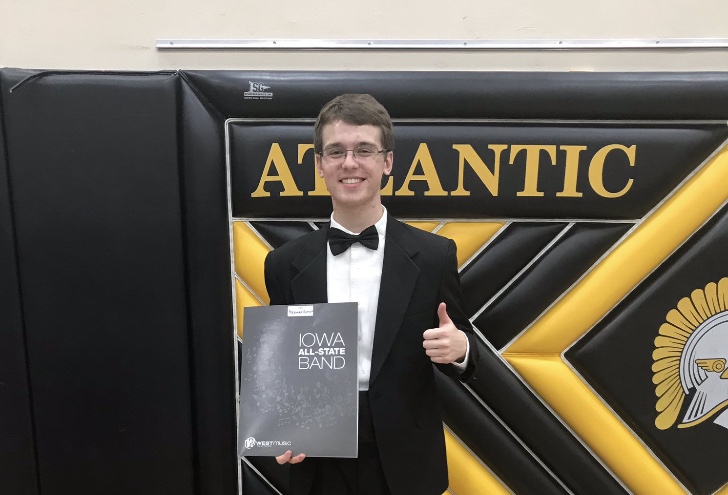 Junior Lex Somers poses with his All-State folder after receiving best of center his sophomore year. Somers will be auditioning for his third time on Saturday.