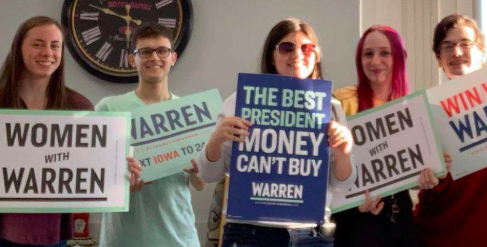 Atlantic High School for Warren members Erin Barrick, Brent Efron, Genevieve Martinez, Savannah Cameron, and Troy Roach show their support with signs. Some of their goals were to be more involved with the community. 