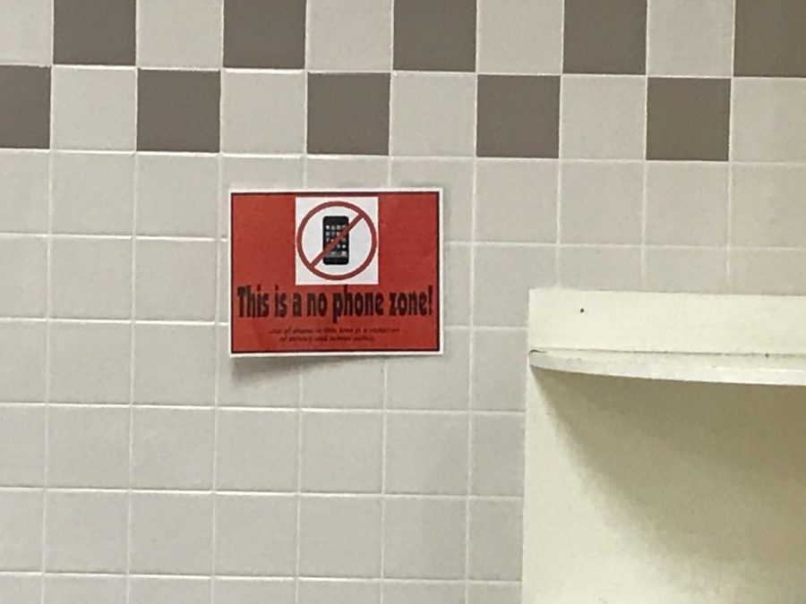 In the bathrooms and locker rooms, there are posters advising students to not use their phones.