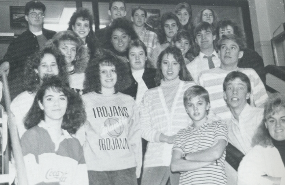 Students pose for a picture with their big, frizzy hair in 1989. They had the side-swoop style, too.