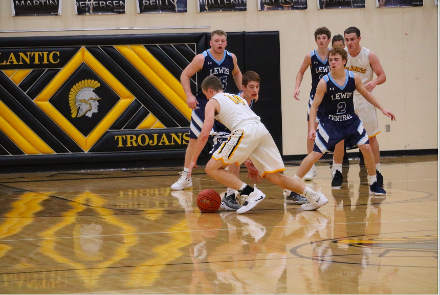 Tyler Moen goes to grab the basketball. Moen has been a varsity player since his freshman year. 