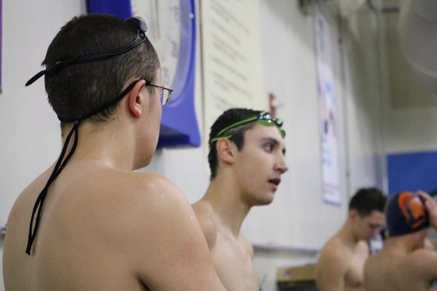 Brothers Cole and Alex Sampson chat after their race at the Nishna Valley YMCA. They were a part of the runner-up 400-yard freestyle relay team.