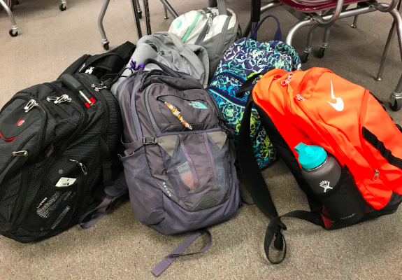 All sorts of bags can be found in classrooms across the school. Some teachers make kids leave their bags out in the hallway, or in one section of the room. 