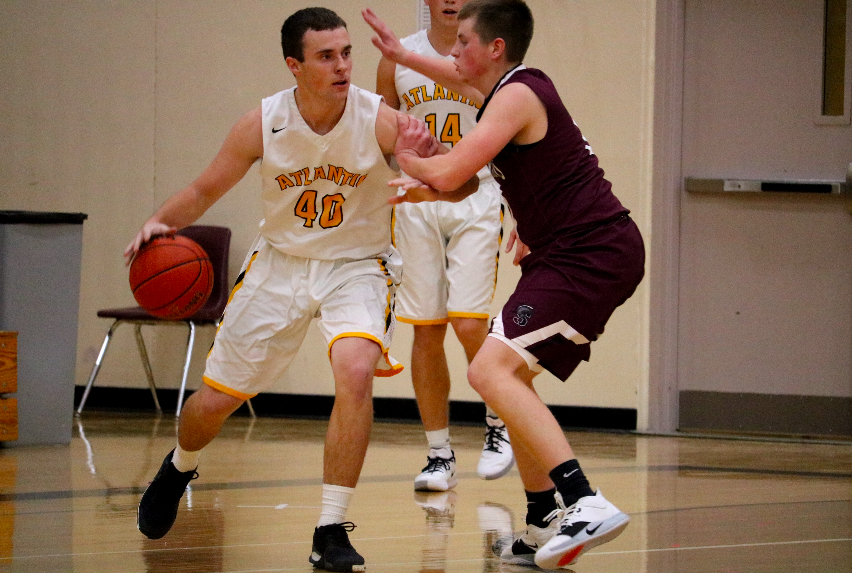 Senior Nile Petersen looks to either pass the ball to a teammate, or drive to the paint. Petersen put up 12 points against Glenwood. 