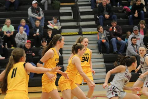 Basketball Teams Split Against Red Oak