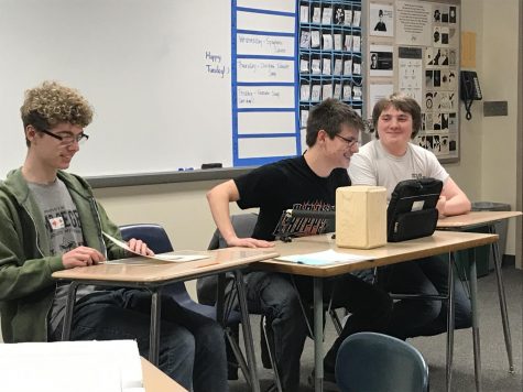 Freshman Weston Hoover sits next to two of game clubs founders, juniors Devlyne Sunderman and Lane Muell. AHS newest addition had been brewing since May 2019.