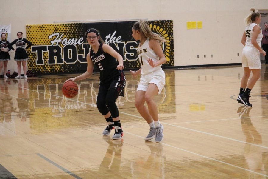 Junior Haley Rasmussen guards her girl in a game earlier this season. Rasmussen has played varsity basketball since her freshman year.