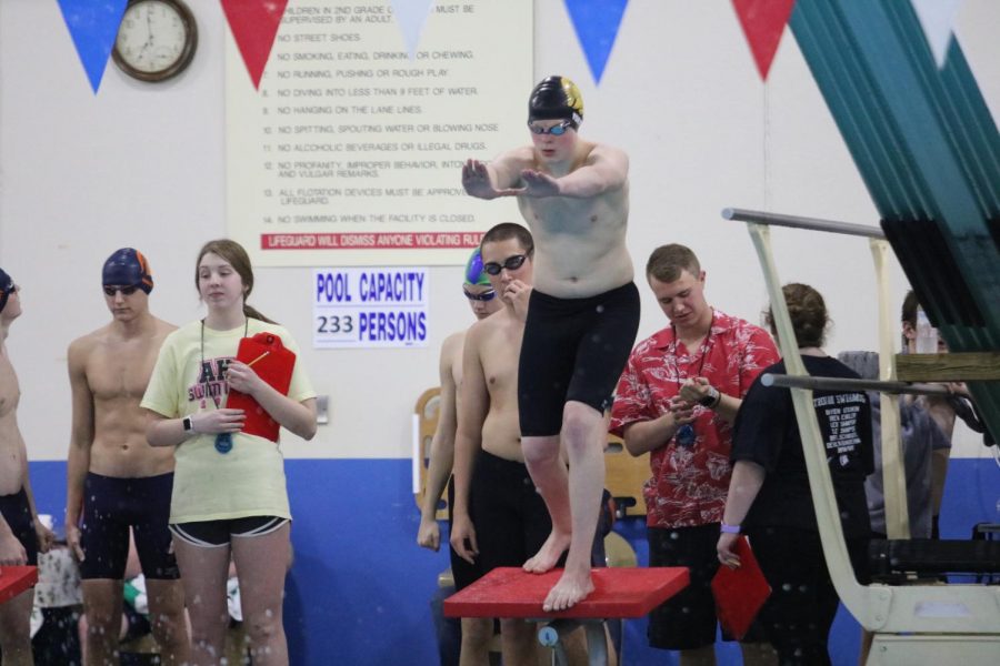 Sophomore Bryan York zones in before jumping off the block. York was a part of four of the top-ten events on Saturday.
