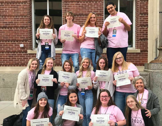 The AHS journalists pose for a picture last fall in Iowa City. The journalism department takes part in this field trip every year. 