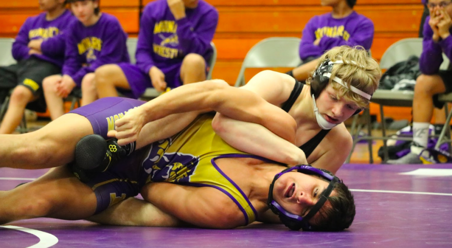 Sophomore Kadin Stutzman holds his opponent to the mat on Thursday night in Denison. Stutzman was one of the double winners on Thursday night.
