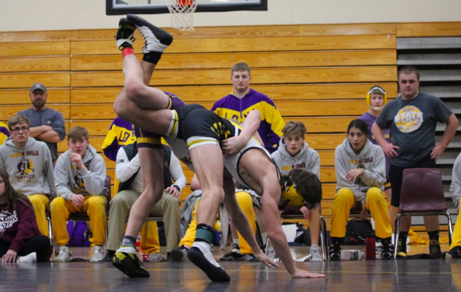 Junior Joe Weaver makes moves during his match. Weaver finished runner-up in his weight class on Saturday.