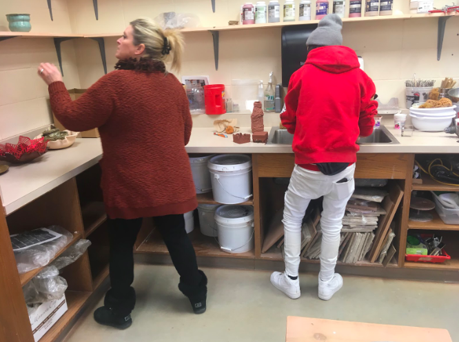 Art teacher Susan Wedemeyer helps freshman Coda Mahan with an art project during her AO period. This is Wedemeyers first year teaching at AHS.