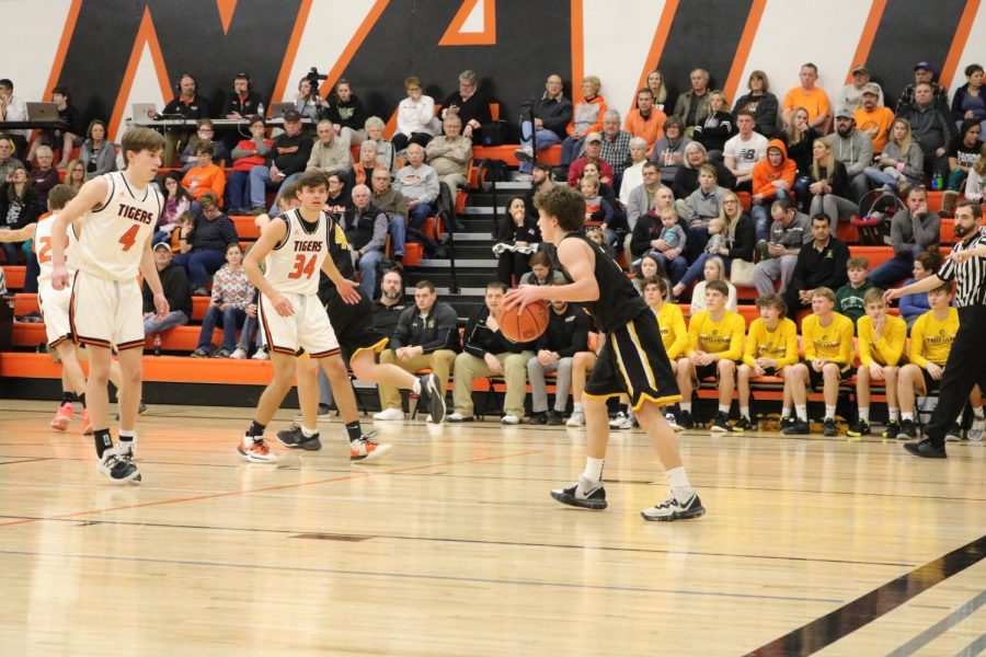 Junior Grant Sturm brings the ball up the floor in Red Oak. In Tuesday nights game, Sturm scored five points.