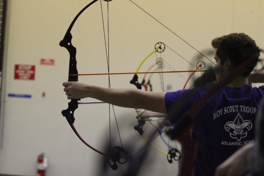 Junior Joe Sonntag prepares to shoot his bow at archery practice. Sonntag shot a 265 at the Nodaway Valley meet.