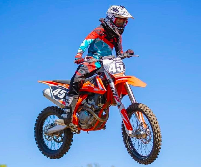 Freshman Zane Brownsberger flies through the air on his dirt bike. The latest competition he attended was in Council Bluffs.