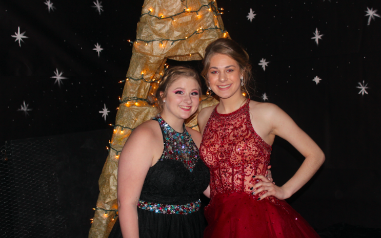 Seniors Gill Askeland and Carli Henderson pose for a picture at Prom last year. The theme was A Tour of Europe.