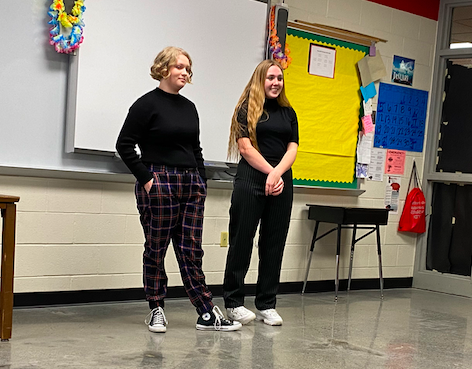 Junior Molly McFadden and senior Aly Brockob prepare to perform at District speech.