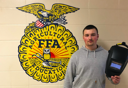 Junior Gunner Kirchhoff poses with his welding mask. Kirchhoff finished first in his category at the Sub-District contest.