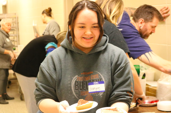 Junior Jasmyne Oasay-Waddell helps at the spaghetti supper dessert table. All band members are required to participate in the supper.