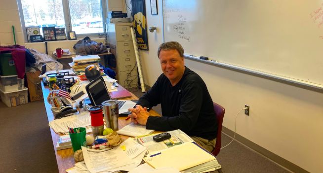 History teacher Trace Petersen sits at his desk during class. On a survey sent out to all students, Petersen had the most-known sayings.