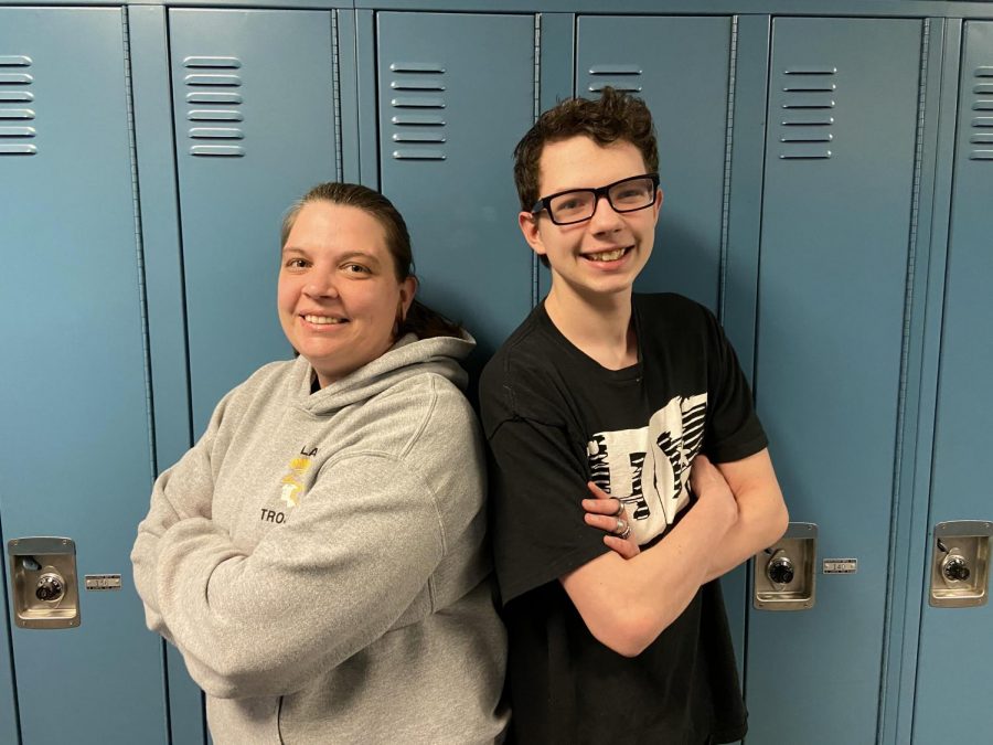 Amber and Xander Moore pose for a picture in the hallway. While his mom doesnt teach a class, X. Moore often gets the chance to talk to his mom during the day.