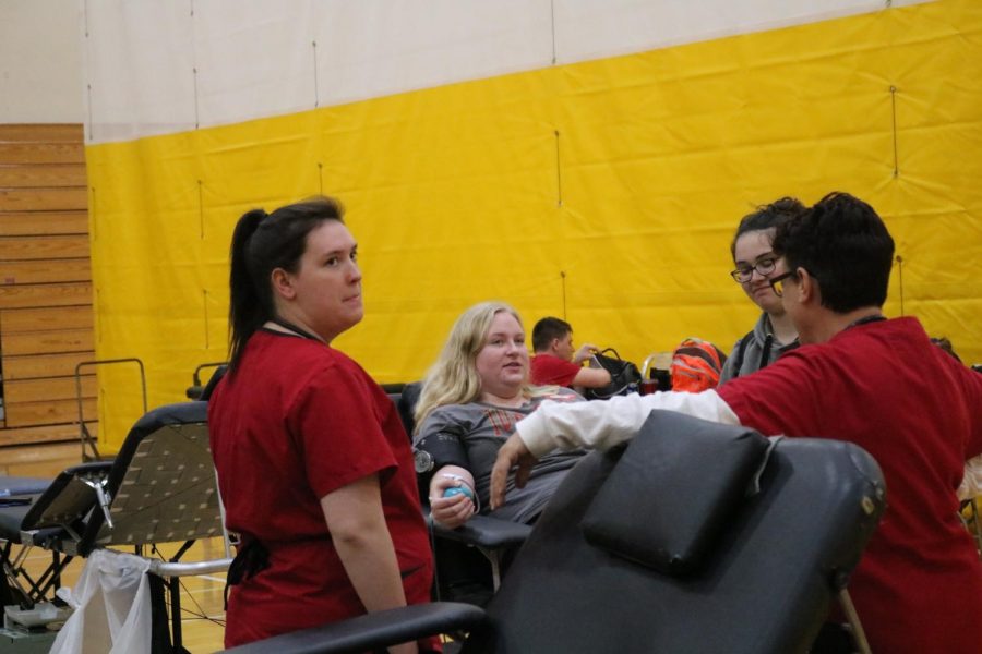 Senior Bethaney Meurer donates blood during the last blood drive. Donators should consider drinking lots of water before they give blood.