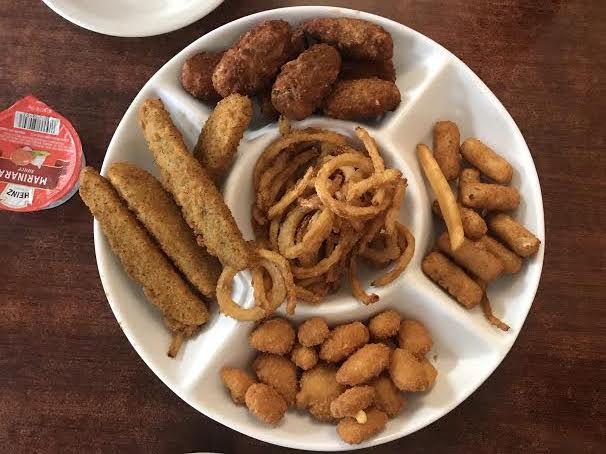 West Side Diner's appetizer plate featured fried pickle spears, onion rings, cheese balls, mozzarella sticks, and jalapeño poppers. They also threw in a lone fry for the memories.