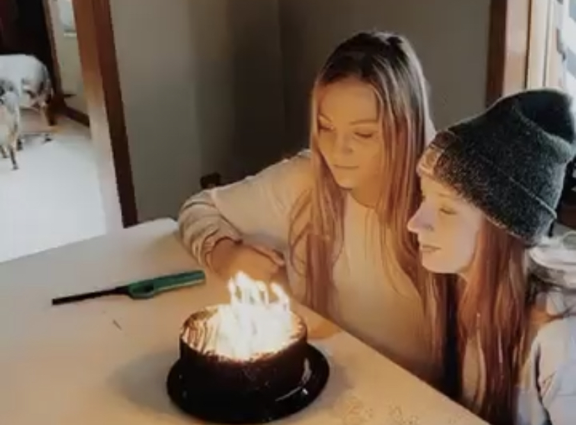 Senior Savannah Cameron blows out her candles with a friend that she shares her birthday with. This year, her birthday was a lot different than usual. 