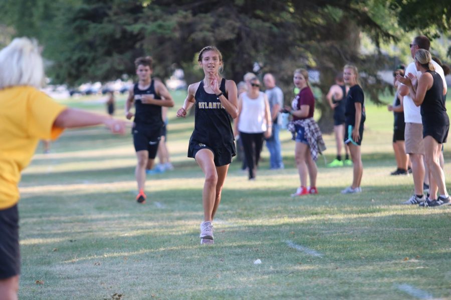 Gwen Irlmeier finishes strong on the last 30 meters of the race. The team battled the 90 degree weather with ice bags waiting for them at the finish. 