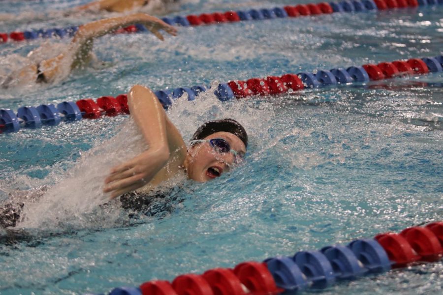 Junior Alexis Reynolds swims in a relay at last years state competition. The girls placed 17th at state. 