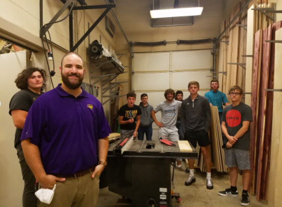 Mr. Widrowicz gathers his fourth period class for a photo. Widrowicz teaches industrial tech classes at both the high school and middle school.