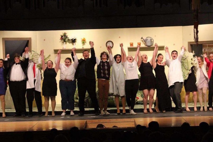 The cast of last years spring musical Little Shop of Horrors, celebrates the end of their performance. This year, the musical will be held during the fall.  