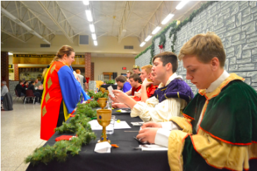 The seniors from last year's madrigal sit at the head table for the Middle-ages themed dinner and performance. There will be a few changes to the holiday concert this year to accommodate to COVID guidelines. 