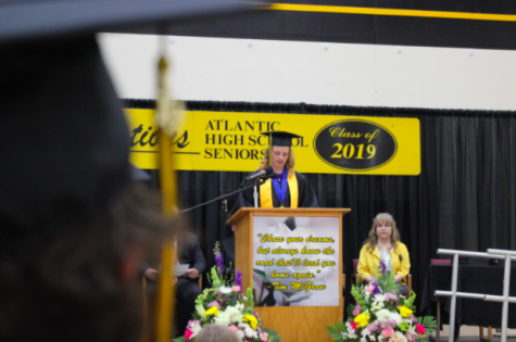 The Class of 2019 adorn themselves in black and gold as they take to the stage for their graduation ceremony. The flowers consisted of perennials.