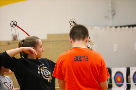 Halle Copeland shoots at a home tournament from last year. Copeland said take into consideration stance, form, and where to aim before shooting an arrow. 