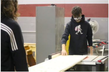 Ryan West and Ethan Peel help build a shed for Rodger Warren from scratch. Warren gave them the plan and dimensions he wanted and the students got to work.