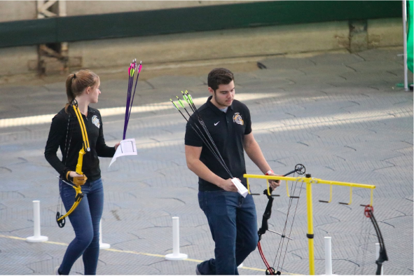 Sophomore Dayna Dreager and senior Joseph Sonntag prepare to shoot at State Archery last year. Both Sonngtag and Dreager think the team is doing well this season, and they hope to continue improving. 