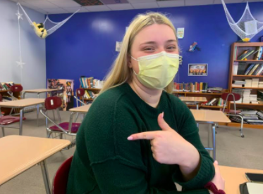 Senior Camryn Church shows off the arm where she got her first COVID-19 vaccine. Church received the Pfizer vaccine on Jan. 17. 